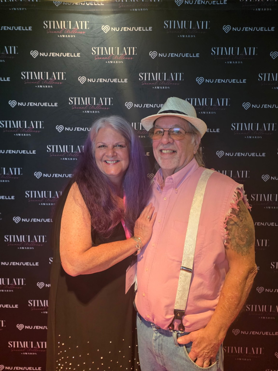 Kathi and James Pepper smiling together at an industry awards event